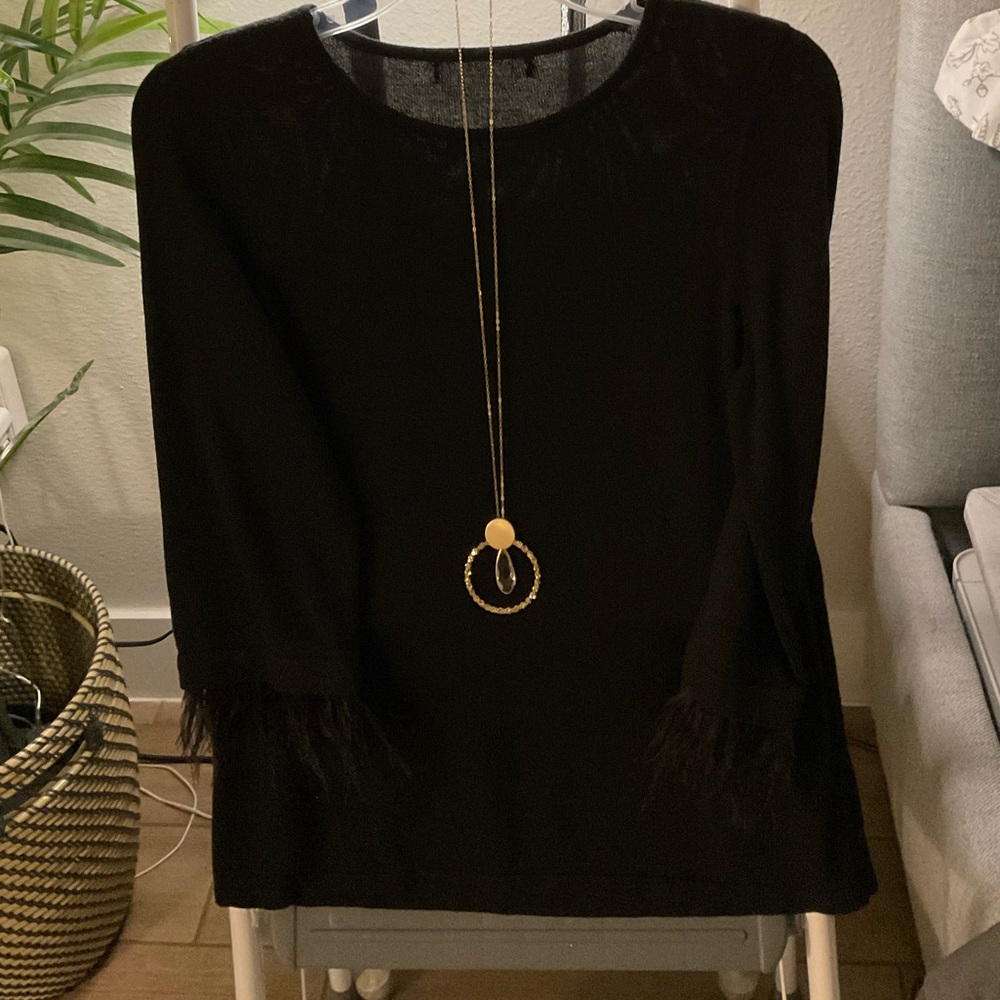 Lightweight sweater can be worn to work or out on a Saturday night